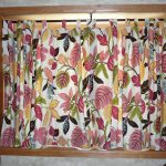 Window curtain with colorful print of leaves